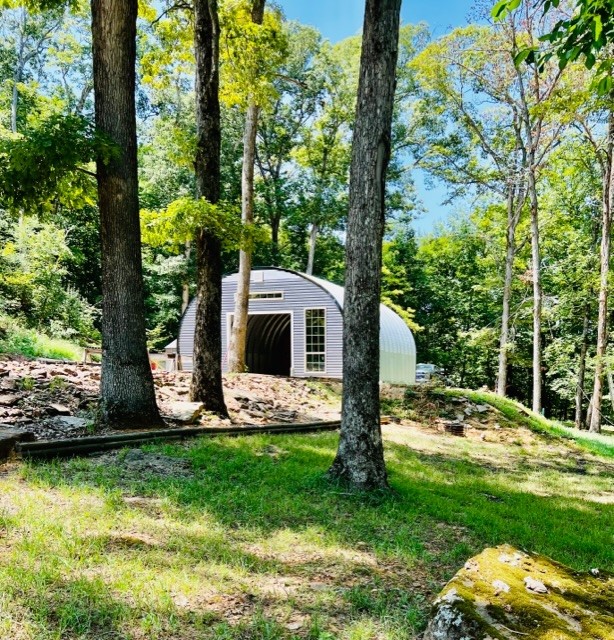 Your perfect recreational retreat is available for purchase, offering a wide assortment of geographical features all within a 15 Acre parcel. The land stretches from a 1650ā elevation to a 1750ā elevation capturing a woodland, natural rock outcroppings, bench land, lush level open mt top pasture with view, plus a wet weather stream and seasonal pond. Amenities were designed to enhance a full or part time RV dwellers lifestyle, with an outdoor terraced living area, beautiful perennial gardens, a firepit and of course a 25X30 workshop for storing your ATVs and bikes. A garden shed is included for your garden tools. Ozarks Go for cable and internet are in place as well as flood lights. An approved Septic system is installed. Owner has enjoyed transporting water from nearby picturesque Tatum Springs. Your ¼ mile of county road frontage on Wyola Road (WC102) is located only 4/10 miles off Parker Branch Road (WC45) and 2 miles from Hwy 71 and 25 minutes to the University of Ar. at Fayetteville.