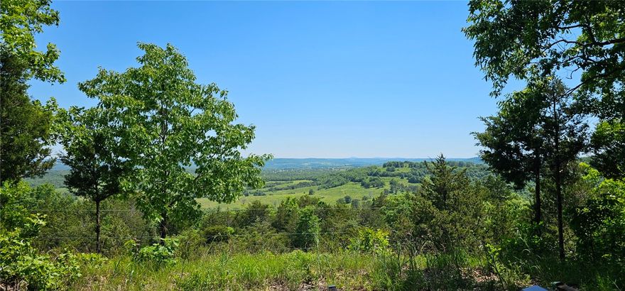 Escape to your own 89.59-acre Ozark retreat! This unique property features two combined parcels offering exceptional, picturesque views in every direction. Perfectly situated for both adventure and convenience, you are just 25 minutesfrom the world-class entertainment and shopping of Branson, MO. You’re also less than 20 minutes from the amenities of Harrison, AR, and the pristine waters of both Table Rock and Bull Shoals Lake. Located in a top-tier school district with incredibly low estimated annual taxes of approximately $107, this is a rare opportunity to own a massive slice of Ozark paradise.