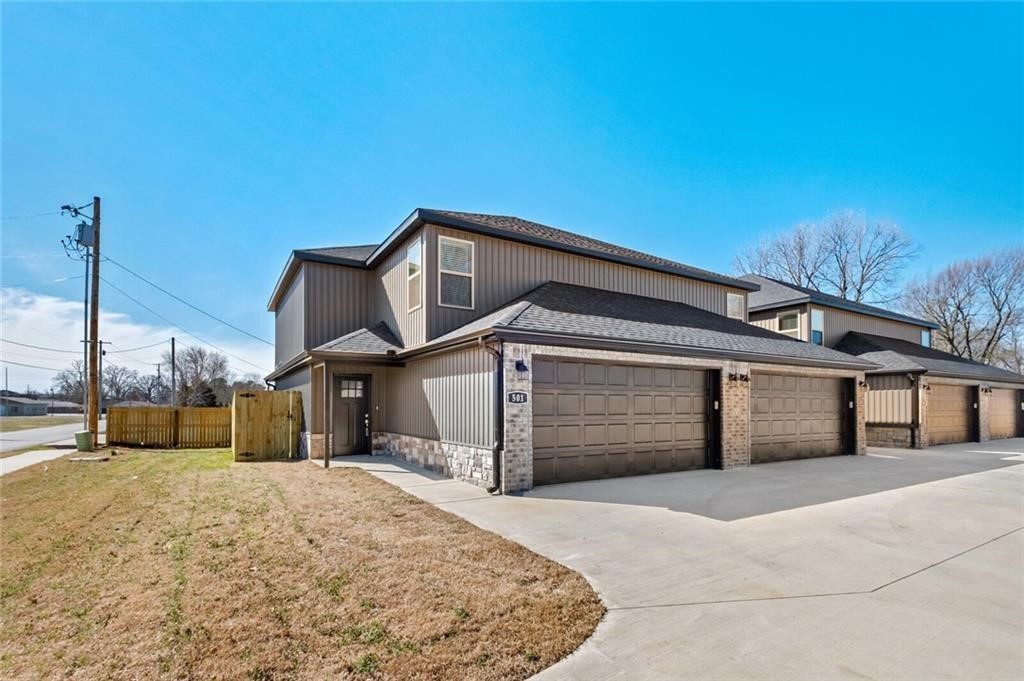 Beautiful townhome located in the heart of Gentry! This townhome features 3 bedrooms, 2 1/2 baths, 2 car garage, granite counter tops, energy start appliances, pantry, gas fireplace with a real wood mantle in the living room, closet storage throughout the house, and his/hers closets in master bedroom! Enjoy the new Gentry ball field placed right across the street! Walking distance to downtown shopping, food, and more!