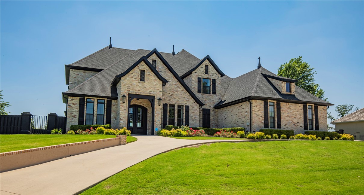 THE PINNACLE LIFESTYLE. Coveted 2016 luxury home, main floor features 2 primary suites and library/home office. Spacious living, dining, kitchen open concept flow - tasteful crown and millwork throughout. Entertain your guests on the covered 18'x17' deck - enjoy your gas log fireplace and motorized privacy screens. Additional 28'x15' patio with pergola, seating benches, and a spacious yard to that begs an inground pool. Primary suite bath features walk-in shower with dual rain shower heads. Soaker tub, dual vanities, closet with built-ins. Second floor features 1) two bedrooms, one with adjoining bath 2) full bath 3) media/flex/second living room 4) attic storage. Circle drive, 2-car garage and the golf cart garage with extra storage. You'll fall in love with this thoughtful floor plan located near the new members' only back entrance off Rainbow. Well maintained, immaculate, comfortable. Your real estate professional will share additional amenities, Country Club membership information, and property disclosure.
