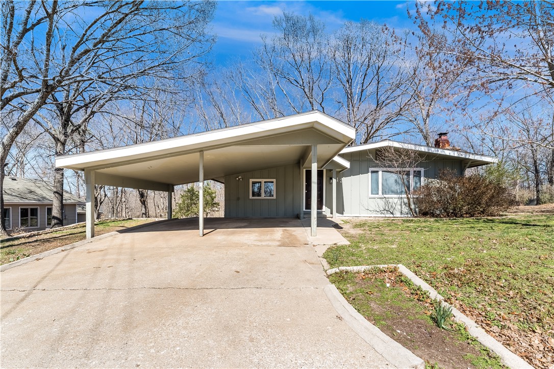 Welcome to this beautifully remodeled AND over-sized Bella Vista Bungalow! All new design with modern aesthetics....paint, fixtures, new kitchen & bathrooms, featuring a secondary living space and workshop! All of this and more sits on a large FLAT CORNER LOT. Great natural light lets you enjoy the peaceful serenity that only Bella Vista can provide. Come see this one-of-a-kind home today.