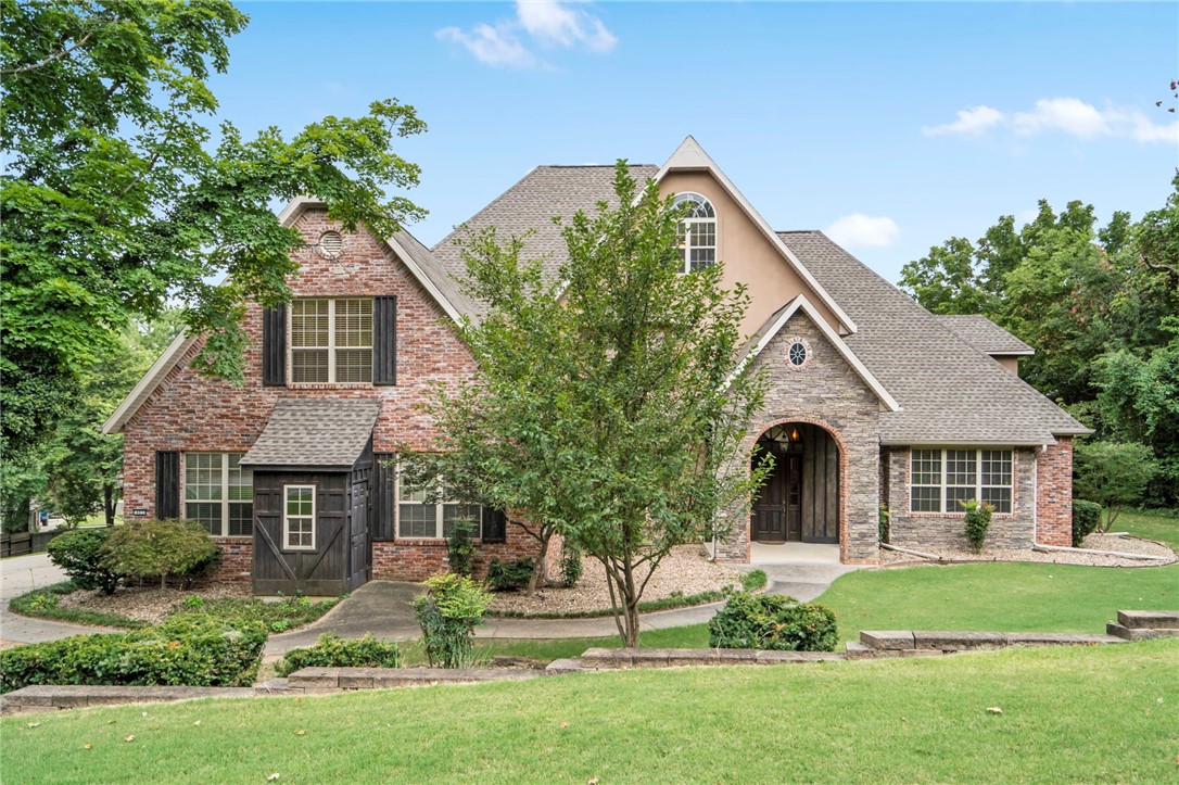 This stunning 5,500 sq. ft. luxury home, situated on over an acre across from Springdale Country Club, offers comfort and elegance. Highly sought after location just a short walk down the hill to Lake Fayetteville and the Greenway trail, and just minutes from I-49, this property combines luxury living with convenience. This home features many upgrades such as a spacious master suite with a steam shower and a large walk-in closet, a large office, 3-car garage, many built-in's throughout the home, a separate in-law suite with a kitchenette upstairs and tons of storage.