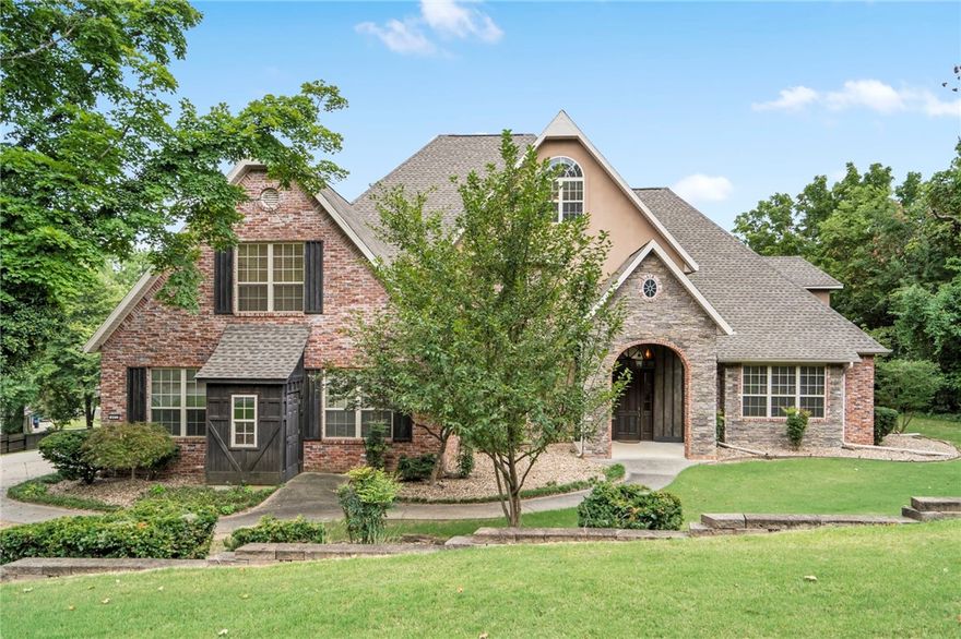 This stunning 5,500 sq. ft. luxury home, situated on over an acre across from Springdale Country Club, offers comfort and elegance. Highly sought after location just a short walk down the hill to Lake Fayetteville and the Greenway trail, and just minutes from I-49, this property combines luxury living with convenience.  This home features many upgrades such as a spacious master suite with a steam shower and a large walk-in closet, a large office, 3-car garage, many built-in's throughout the home, a separate in-law suite with a kitchenette upstairs and tons of storage.