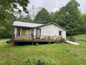 3BR-2BA home on 29.56 acres with an old outbuilding. Private location and could have a nice view with clearing some trees. Metal roof is 5 years old. Selling AS IS.