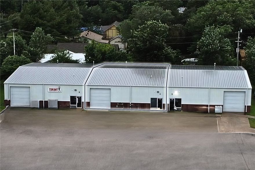 One 10' bay level door. 13' clear height and 17' peak height. One small office and one bathroom. Less than a mile away from us, 71-b. 3.4-mile drive to i-49