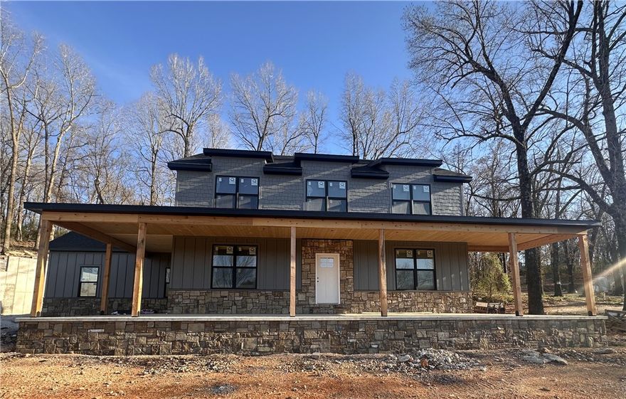 This beautiful new home built by PMI construction offers a wonderful blend of space, privacy, and modern comfort. With two thoughtfully designed stories, this home provides room for everyone to spread out while still feeling warm and inviting.
The primary suite is conveniently located on the main level, with a well-appointed bath and a nearby half bath for guests. Upstairs, you’ll find three spacious bedrooms plus an office/bonus room. One of the upstairs bedrooms is oversized and could easily serve as another bonus room, media space, or playroom.
Start your mornings on the expansive front porch, perfectly sized for porch swings and slow coffee mornings, and unwind in the evenings enjoying peaceful views. Upstairs, a private rear deck offers direct access to the upper portion of the property — ideal for exploring, entertaining, or simply enjoying the extra space. Come see it!