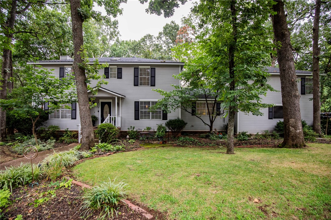 This classic, charming, traditional style house has plenty of space and is located in an established, central east Fayetteville neighborhood. This is one of the best neighborhoods in town with a strong sense of community and pride of ownership, plus it's walking distance to Gulley Park! Zoned for Root, McNair and Woodland Jr High schools.
At this price, you'll get plenty of square footage and charm with room to do some updates if you choose. The big stuff has been done in recent years - including a new roof and HVAC equipment!
There are two potential primary suites on different ends of the house; could be perfect for in-laws, guests, or a private, quiet office space. An open, spacious outbuilding in the back yard could be an art studio, kids playhouse, or workshop. The backyard is a great setting for family dinners under the lights and oaks and the covered back porch the ideal place to have some coffee or drinks with friends, even in the rain!