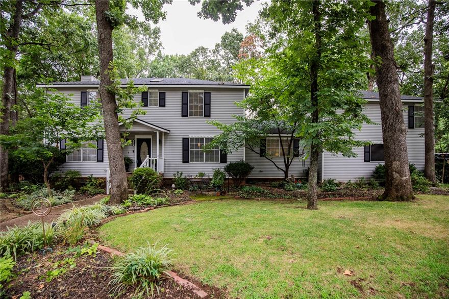 This classic, charming, traditional style house has plenty of space and is located in an established, central east Fayetteville neighborhood. This is one of the best neighborhoods in town with a strong sense of community and pride of ownership, plus it's walking distance to Gulley Park! Zoned for Root, McNair and Woodland Jr High schools. 

At this price, you'll get plenty of square footage and charm with room to do some updates if you choose. The big stuff has been done in recent years - including a new roof and HVAC equipment! 

There are two potential primary suites on different ends of the house; could be perfect for in-laws, guests, or a private, quiet office space. An open, spacious outbuilding in the back yard could be an art studio, kids playhouse, or workshop. The backyard is a great setting for family dinners under the lights and oaks and the covered back porch the ideal place to have some coffee or drinks with friends, even in the rain!