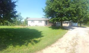 Convenience with country peace and quiet! Located just out of Harrison city limits, with access to Harrison or Bergman schools. Home can be used as a three or four bedroom, two bath. Large deck with peaceful backyard. Landscaped yard, storage building, insulated garage and workshop area.