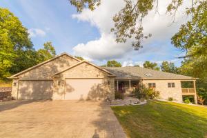 Gorgeous custom built executive style home on nearly 3 acres, conveniently located between Harrison and Omaha. Huge 2400+ sq ft attached garage with outdoor RV parking area!! Wrap around deck on two sides with hot tub. Indoor heated/cooled dog kennel. Main level has two bedrooms and two bathrooms. Basement has another bedroom, 1.5 baths, a large bonus room, plus a family room that is plumbed for a wet bar. Basement also has a workshop area and a storage room. Seller is in the process of finishing final touches in basement (trim, plumbing fixtures, etc.)
