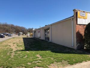 A 2 BR apartment is included with two commercial buildings and 2.4 acres m/l on busy US Hwy 65 in Harrison. Also fronts Vine Rd. Warehouse, retail space, offices and residential apartment or manager quarters. 22,000+ Sq. Ft. of mostly warehouse space with high traffic location and good visibility. This property could be used as 2 warehouses or converted to multiple applications andstore fronts. Smaller building is rented for $1550 per month on a month to month basis. The south end of property along and in creek is in the flood plain per Data Scout map. No air conditioning in warehouse spaces. Age of buildings is unknown. The older building could be a hundred years old or more. Lots of possibilities! Square Footage is per county tax records. Confirm zoning with city of Harrison.