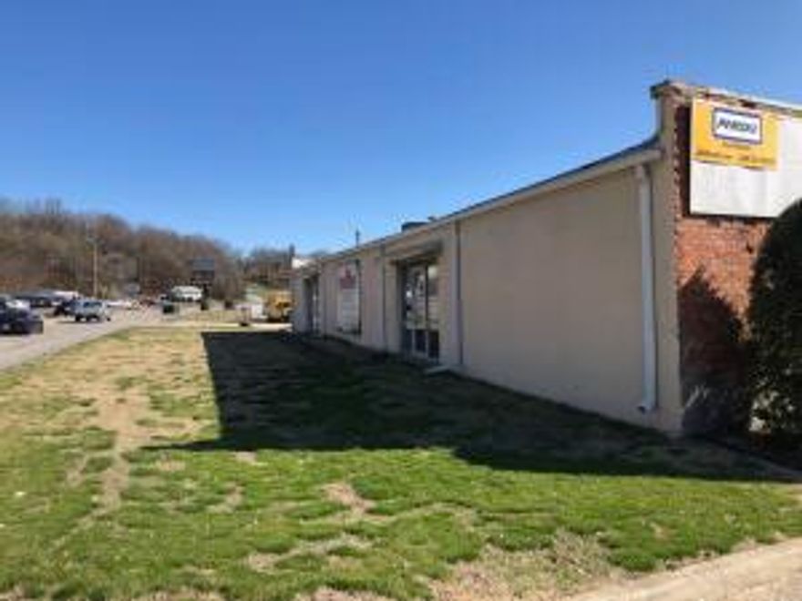 A 2 BR apartment is included with two commercial buildings and 2.4 acres m/l on busy US Hwy 65 in Harrison. Also fronts Vine Rd. Warehouse, retail space, offices and residential apartment or manager quarters. 22,000+ Sq. Ft. of mostly warehouse space with high traffic location and good visibility. This property could be used as 2 warehouses or converted to multiple applications andstore fronts. Smaller building is rented  for $1550 per month on a month to month basis. The south end of property along and in creek is in the flood plain per Data Scout map. No air conditioning in warehouse spaces. Age of buildings is unknown. The older building could be a hundred years old or more. Lots of possibilities! Square Footage is per county tax records. Confirm zoning with city of Harrison.