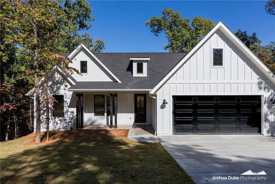 Your clients want "IT", This home has "IT", You better get "IT", before it is gone. Rare find in Bella Vista where builder built a custom home instead of a spec. This farmhouse style home located on a public sewer lot features a sodded yard, stainless steel appliances, an oversized 2 car garage, a large walk in pantry, a large deck with access from the master bedroom, tons of storage, and a whole lot more. Schedule your showing today! Amenities list is attached. Garage door is to be painted black.