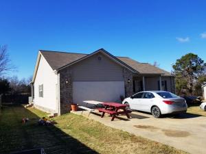 4BR 2BA Newer home close to town, covered front & back porch, cathedral ceiling, partial privacy fence, master bedroom & bath, Ready for new owners!