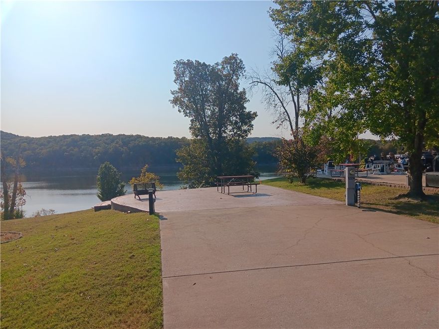 Extra Large Lot with gorgeous Water Front views offers a rare back in set up for the RV. Recently surveyed, this lot awaits your creativity. Rental Pool Option for additional income.