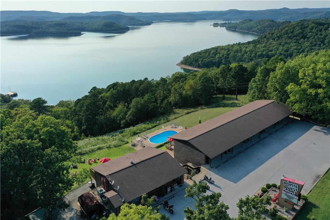 Incredible investment opportunity in the Ozarks! This iconic and well-maintained 23-unit motel offers stunning views of Beaver Lake and is located just minutes from Lake Leatherwood and the Beaver Dam. Trip Advisor ranked Pointe West Resort #1 for 8 years vs their 35 local peers. Each unit features a unique theme, creating a memorable guest experience that drives strong, repeat business year after year. The property includes on-site managerās quarters, ample parking, a swimming pool, and peaceful natural surroundings. Guests return for the charm, the scenery, and the unmatched locationāperfect for boating, fishing, biking, and hiking. With loyal clientele and a reputation for meticulous upkeep, this turnkey motel offers stable income and growth potential. Itās clear from the moment you step on-siteāthe owners take pride in every detail. Donāt miss this chance to own a profitable piece of paradise in Northwest Arkansas!