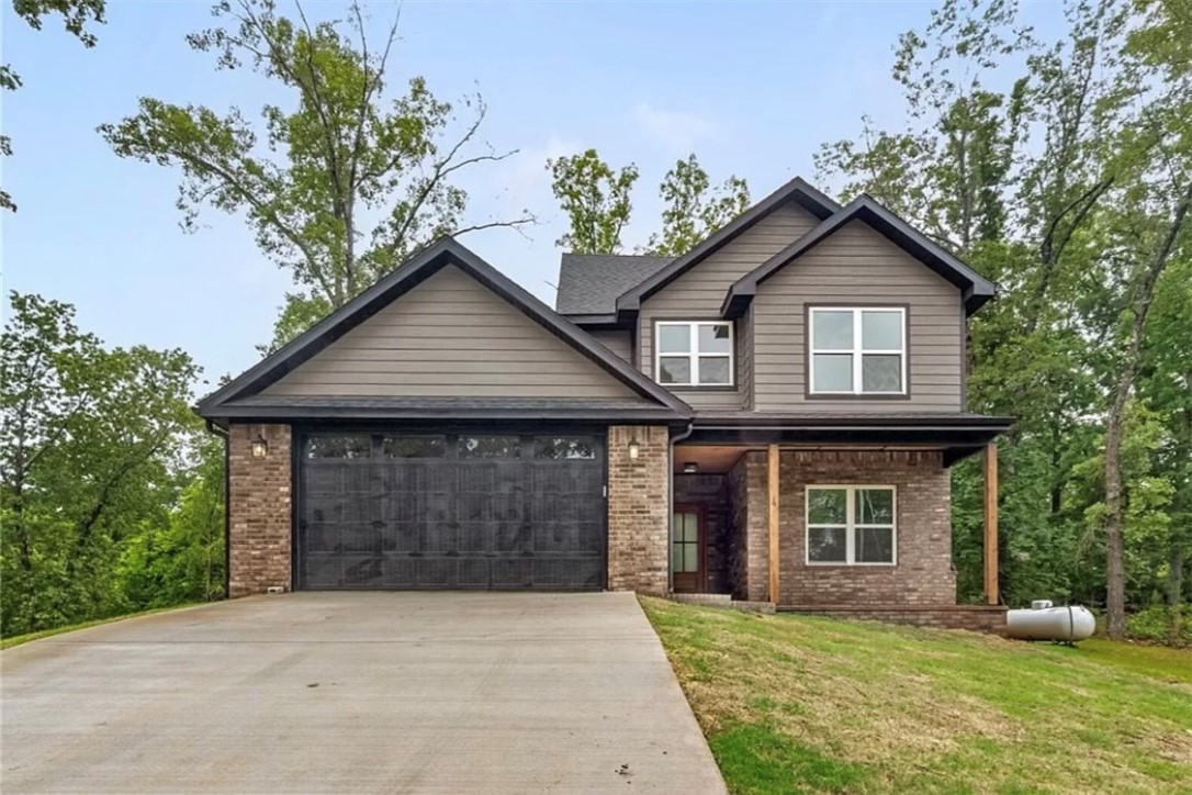 Sellers will offer $10,000 in buyer concession!!! Welcome to your dream home in the heart of Bella Vista, Arkansas! This captivating residence boasts a unique blend of comfort, style, and luxury making it the perfect place to call your home. Situated on a generous double lot, this property offers an expansive space (room for a pool or a shop) that combines tranquility with modern living. The heart of this home is the impressive 18-foot fireplace, serving as the centerpiece of the living room. Gather around the hearth for cozy evenings or entertain guests in style. The home boasts custom cabinets with soft close hinges throughout and custom steel cable railing on the second floor. Located only 27 minutes from the Bentonville Squareās dining & entertainment options, you will also have boundless opportunities with the Bella Vista golf courses, recreational facilities and lakes. It is minutes from the countless bike trails in Bella Vista and Bentonville. .