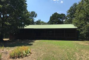 Large front porch all across the front of this rustic home is where you will sip tea and enjoy looking at the wildlife over your 10 acres. If you have a hobby, there is a large shop for you to be creative. Home features 3 bedrooms, 2 baths, open living dining area.Seller is Secretary of Veterans Affairs, seller does not pay customary closing cost or title policy, escrow fees, survey or transfer fees. POF or Pre-qual dated 30 days or less required with offer. This property may qualify for Seller Financing (Vendee)