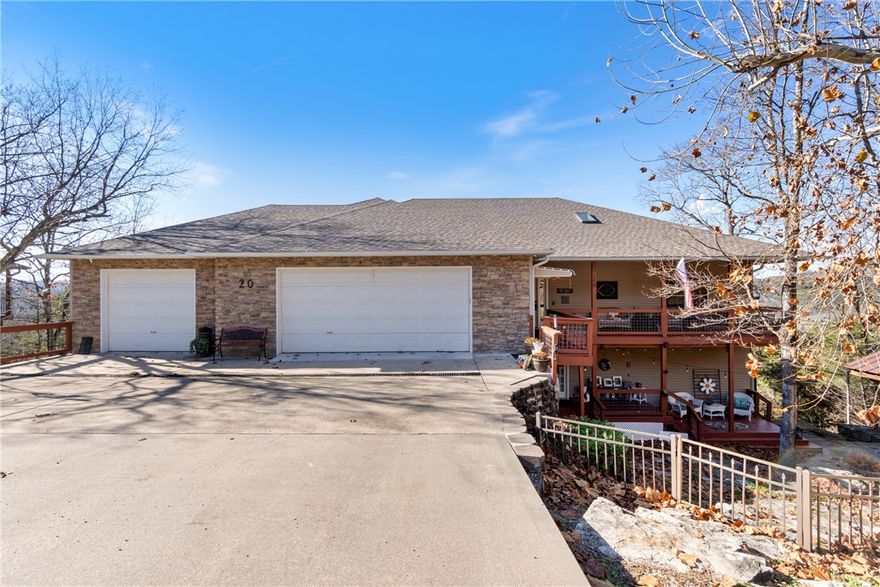 Discover stunning lake views in this beautifully updated 5-bedroom, 3-bath home offering 3,475 sq ft of comfortable, spacious design. Perfectly situated to capture gorgeous views from nearly every window. A large, updated kitchen anchors the main level, offering abundant cabinets and counters for everyday living or entertaining. Home features two high efficient American Standard heat pumps with upgraded air filtration system. You’ll also find a whole-home generator for peace of mind.This floor plan includes a large rec room with fireplace, inviting living area, and two oversized bedrooms. The unfinished basement is already framed and floored, providing a head start for future expansion. Outdoor living shines with flagstone patios and covered decks, perfect for enjoying the serene surroundings. The fenced yard adds convenience for pets or play. A 4-car garage, encapsulated crawlspace w/ sump pump and dehumidifier are just a few more updates. Spacious, updated, and positioned to take in breathtaking views!