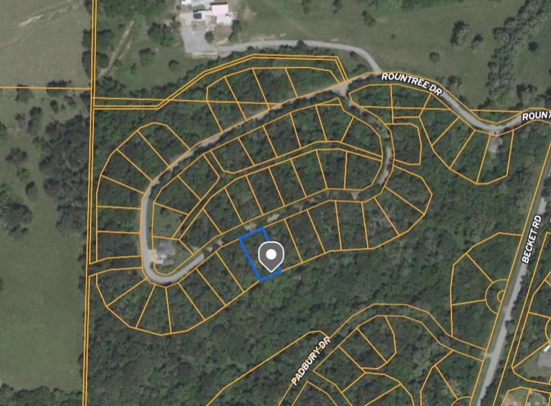 Tucked away in the Rountree Subdivision of Bella Vista, this 0.30-acre lot offers a great opportunity to build or invest. Located in Benton County and the Bentonville School District, it's near the end of Rountree Lane for added privacy and surrounded by woods. Enjoy access to Bella Vista’s trails, golf courses, and amenities—perfect for your future getaway or portfolio addition.