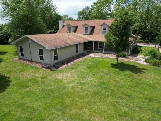This great property boasts a spacious 5 beds, 2 baths house nestled on 20 Acres of land. With over 4000 sq ft of living space, the house features a cozy wood stove in the living room, perfect for chilly evenings. The large family room provides ample space for gatherings & is equipped with a fireplace. Safety is a top priority w/an in house storm shelter and an auto switch whole house generator to ensure continuous power supply. Outside you'll love the frost free water hydrants, & the 18 ft round above ground swimming pool for summer fun. For those who love to tinker there is a 40 X 80 metal shop w/3 overhead doors, a 30 X40 enclosed shop w/lean to, a loafing shed and a small storage building. The property also includes a 2 car garage & a 1 car carport for convenient parking options. The home layout includes 3 beds on the 1st floor while the 2nd floor features 2 bedrooms & a bonus room, offering flexibility & additional living space. The house is on Rural water and a well furnishes the water for the outside.