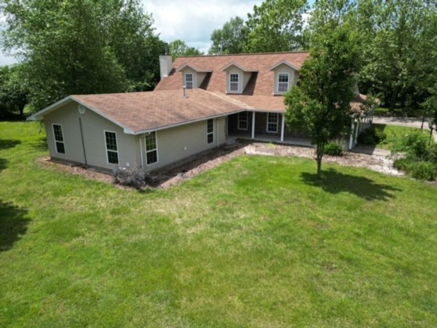 This great property boasts a spacious 5 beds, 2 baths house nestled on 20 Acres of land.  With over 4000 sq ft of living space, the house features a cozy wood stove in the living room, perfect for chilly evenings.  The large family room provides ample space for gatherings & is equipped with a fireplace. Safety is a top priority w/an in house storm shelter and an auto switch whole house generator to ensure continuous power supply. Outside you'll love the frost free water hydrants, & the 18 ft round above ground swimming pool for summer fun.  For those who love to tinker there is a 40 X 80 metal shop w/3 overhead doors, a 30 X40 enclosed shop w/lean to, a loafing shed and a small storage building. The property also includes a 2 car garage & a 1 car carport for convenient parking options. The home layout includes 3 beds on the 1st floor while the 2nd floor features 2 bedrooms & a bonus room, offering flexibility & additional living space.  The house is on Rural water and a well furnishes the water for the outside.