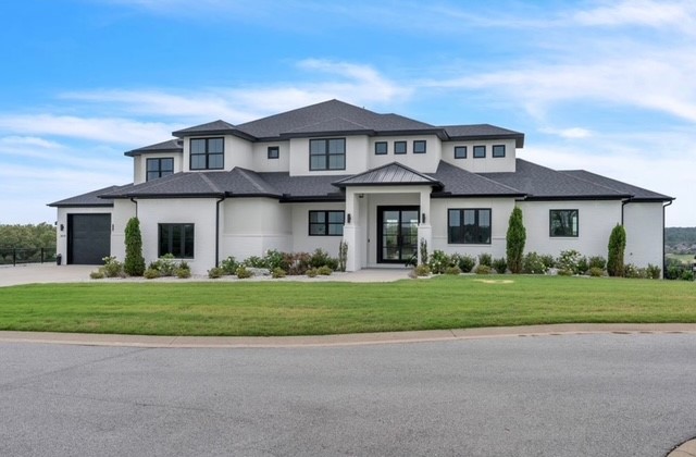 Step into a breathtaking luxury residence, with pool house, offering meticulously designed living space, maximized storage and workshop areas. Every detail of this estate is crafted for elevated living from the executive office space on the main floor to the gourmet kitchen outfitted with double ovens, a butler’s pantry, and a commercial grade refrigerator. The residence boasts custom solid wood doors, white oak flooring, and UV-protected windows that flood the home with natural light. Step outside to your private oasis featuring a heated in-ground saltwater pool with a remote-controlled safety cover. Entertain effortlessly in the poolside guest house, complete with a full bath and built-in Murphy bed. The expansive outdoor kitchen & sundeck, designed for comfort and functionality. Energy efficient features and top tier finishes ensure this home is as smart as it is stylish. Whether hosting a soirée or enjoying a peaceful retreat, this property is the ultimate statement in modern luxury living.