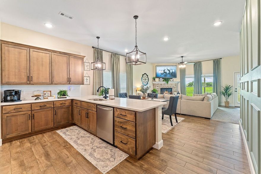 Welcome to 404 NW 59th Ave, Bentonville, AR!
This stunning 2023-built home won’t last long!

The charming front porch sets the stage, leading into a beautifully decorated interior. The open-concept kitchen is a true showpiece featuring quartz countertops, custom lighting, & a seamless flow into the dining area—perfect for entertaining. The spacious llght-filled living room is highlighted by an inviting fireplace, ready to cozy up this winter.

The primary suite offers plenty of space to unwind, complete with a luxurious en-suite featuring dual vanities, walk-in shower, soaking tub and a large walk-in closet that connects conveniently to the utility room. Across the split floor plan, you’ll find two generously sized guest bedrooms and a full guest bath.

Step outside to enjoy gorgeous country views with no neighbors behind the property—rare for this location!

Don’t wait—schedule your tour today before this home is gone!