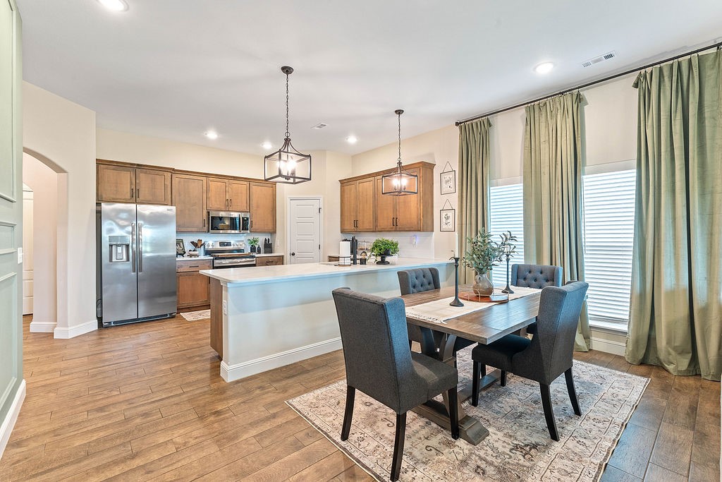 Welcome to 404 NW 59th Ave, Bentonville, AR!
This stunning 2023-built home won’t last long!
The charming front porch sets the stage, leading into a beautifully decorated interior. The open-concept kitchen is a true showpiece featuring quartz countertops, custom lighting, & a seamless flow into the dining area—perfect for entertaining. The spacious llght-filled living room is highlighted by an inviting fireplace, ready to cozy up this winter.
The primary suite offers plenty of space to unwind, complete with a luxurious en-suite featuring dual vanities, walk-in shower, soaking tub and a large walk-in closet that connects conveniently to the utility room. Across the split floor plan, you’ll find two generously sized guest bedrooms and a full guest bath.
Step outside to enjoy gorgeous country views with no neighbors behind the property—rare for this location!
Don’t wait—schedule your tour today before this home is gone!