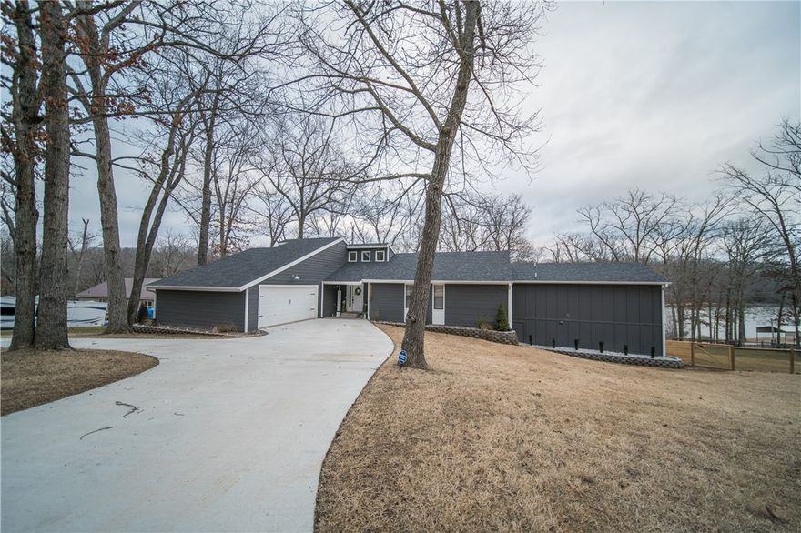 BACK ON THE MARKET! This INCREDIBLE home has stunning lakes views from almost every room in the house. with only a  slightly sloping (not steep) walk to the lake, you will enjoy all that Lake life has to offer, year round. Or maybe you will love listening to the water lapping along the shores from the hot tub on the back deck.  This 4 bedroom, 4 full bath home has just been completely remodeled & updated with high end finishes & plenty of room for everyone. Upstairs includes 3 bedrooms, 2 full bathrooms, kitchen, dining, living room & a sitting room overlooking the lake. The master bath is oversized, with a huge walk in shower with rainfall shower heads, and a stand alone soaking tub. The laundry room even connects to the Master! Downstairs has a large second living space, including a bar, and access to the patio. It also boasts another private bedroom with its own sitting area with a linear fireplace. Maybe you're ready for space on the lake, or maybe you're an investor looking for a vacation home.