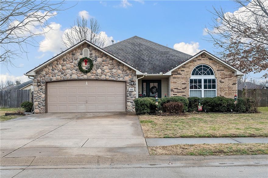 Welcome home to this charming 3-bedroom, 2-bath home situated on a corner lot with an oversized backyard you’ll love. Enjoy great curb appeal and a flat, spacious driveway that makes parking easy. Inside, a welcoming entry opens to a bright family room with cathedral ceilings and a modern feel that instantly feels like home.

The kitchen features new granite countertops, an updated backsplash, and updated appliances, while new light fixtures throughout add a fresh, cohesive look. Both bathrooms have been refreshed with new mirrors for a clean, updated touch.

The oversized backyard is a standout, complete with a 20x30 concrete pad—perfect for extra parking, outdoor entertaining, or a basketball area. Conveniently located just a short walk to the park and downtown Gentry, this home offers comfort, updates, outdoor space, and an ideal location all in one.