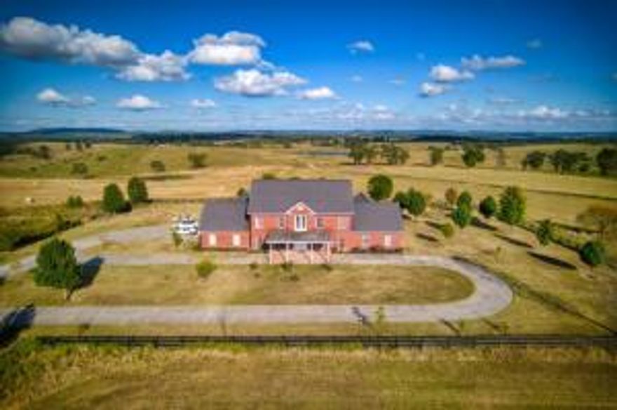 Stately best describes this colonial inspired estate. Truly a must see home. Features include over 6000 sq. ft Brick home on approximately 21 very level acres, a new survey will be provided by the seller. There are so many features to this property, large his and her walk in closets, all upper level bedrooms have walk in closets, even a large shoe closet. Safe room is all concrete with a double steel door and features a large gun rack. 12 foot ceilings on both levels. Roof was replaced in 2018. Upper level 32 x 20 balcony. Wood furnace included.   New well in process of being drilled should be completed in November. Oversized 3 car garage. Steel Pole fencing.  Appliance credit will be given.