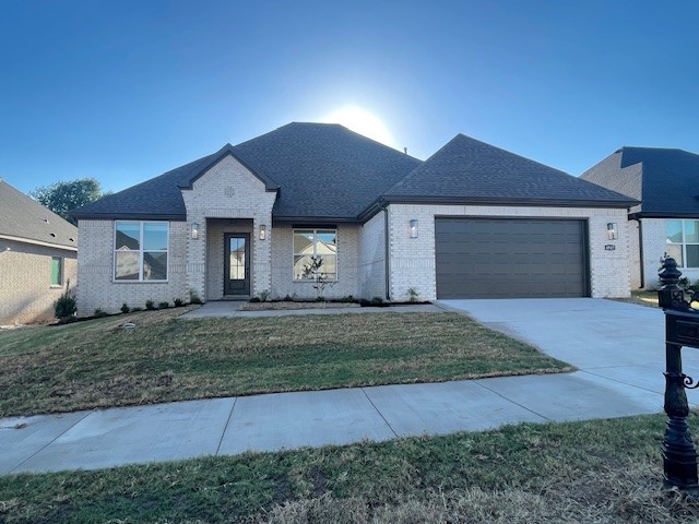 Sold before print! The picturesque Princeton 4 plan in Henderson Park, located in Fayetteville, Arkansas! The Princeton 4 plan has 2424 square feet, with 4 bedrooms, 3 baths and a flex space/study. Fantastic front porch with a sitting area. Upon entrance, there is a flex space / study and a spacious living area featuring a gas fireplace. These homes will be 4-sided Brick. Flooring is Wood Laminate plank flooring and carpeting in the secondary bedrooms! The Kitchen will have an oversized kitchen island, quartz countertops and 42-inch upper cabinets with top molding with an Upgraded Stainless steel appliance package. The Living room will have a Beautiful Gas Fireplace. LED lighting throughout! 2-inch blinds throughout! Ceiling fans! High efficiency air conditioner system with Programmable WI-FI thermostat! Tankless hot water heater! Bedroom one will have double sinks, oversized walk-in shower, and a SOAKING TUB!! Covered Patio! Gutters included! Springdale Schools. Taxes TBD.