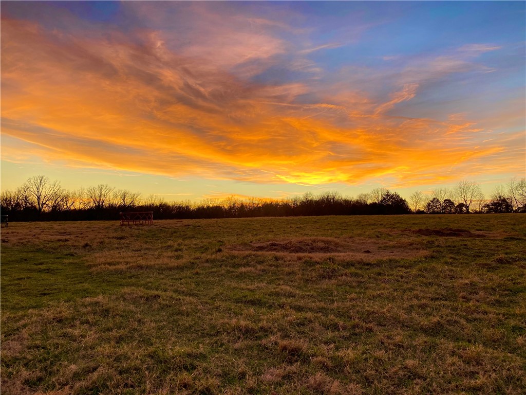 Gorgeous views of sunsets and sunrises from this incredible 6 acre tract. This dream property is only minutes to downtown Fayetteville but still in the country. Five minutes to Lake Sequoyah and hiking trails. Cleared pasture ready to build.