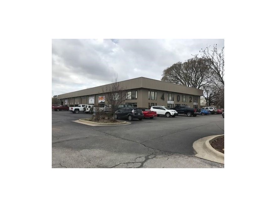 Commercial building is on 1.68+/- acres. "60ml., 15 year warranty TPO" roof. New paint, new outside LED lighting. Has multi-tenant cash flow approximately $5,750 p/m and includes some two story space. Main building is 19,800 sq.ft and includes 14,400 sq.ft. downstairs wit 5,400 sq.ft. upstairs. Separate smaller building 402 B measures larger but County shows 1282 sq.ft. Property has pad sire to the West as part fronting S Kansas St across from Springdale High School. Approximate occupancy 55%