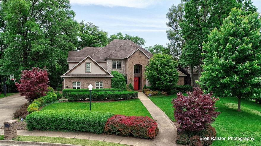 Absolutely stunning! Spectacular home surrounded by mature tress & nature. Enjoy the convenience of being only minutes from Walmart home office, Bentonville square, & I49. Indulge in your own private heated swimming pool with guest house! Within walking distance to dog park and bike trails. Beautiful hardwood floors (newly refinished) on main level, new carpet on 2nd floor, granite counters throughout, 3 fireplaces, big kitchen w/double oven & breakfast bar. 1.89 acre lot provides privacy & serenity!