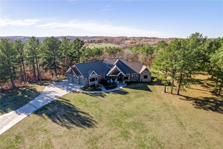 Surround yourself in nature and luxury!!! This custom built home was made for comfort and energy efficiency. From top to bottom, there is not a detail that was spared!! With over 6500sf, this stunner boasts 8 Bedrooms, 4 full bathrooms, 2 half bathrooms, 2 living spaces, sun room, media room wired for a projector, 2 kitchens, outdoor kitchen, safe room, and with nearly 5 acres.....This home truly has it all. Energy Efficiency in a home of this size is almost unheard of, but not for this home. For a full list of features, please see the last picture of the listing photos. Just inside of Huntsville city limits, 20 mins from Fayetteville, 20 mins from Springdale, & 35 mins to Downtown Rogers.....this home is perfect for those who want some privacy, but also want to be close to everything happening in NWA!
