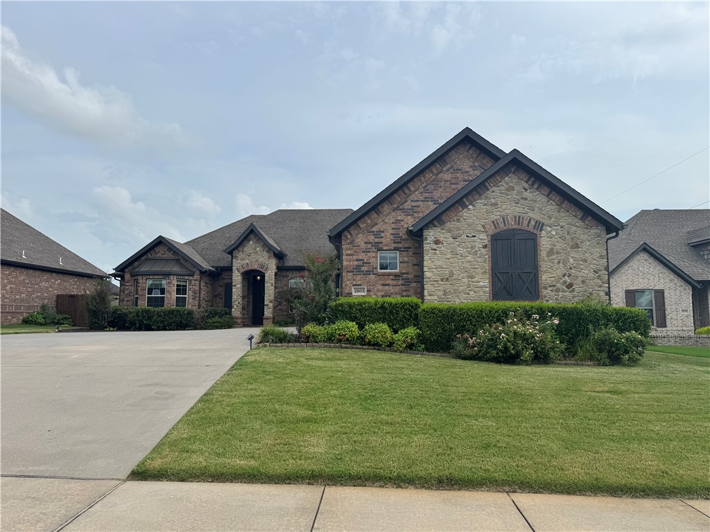 Spectacular home in Wildwood subdivision. walking distance from schools and Bentonville community center, 4 Bedrooms, 3 bathroom, Amazing elevation w/ two living and formal dining, jack and Jill bathroom, custom knotty alder cabinets throughout, a vaulted ceiling with wood beams in the main living room, extensive crown molding throughout, artistically tiled shower in the Primary bedroom, large patio with outdoor built in grill with granite countertop..