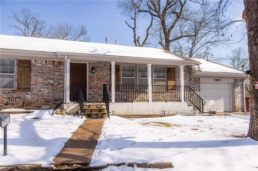 We’re making it even easier to call this half-acre property YOURS. Special financing incentives available including a $2,500 lender credit toward buyer closing costs. Inquire for details! 

Tucked away at the end of a quiet cul-de-sac and bordered by a private tree-lined backyard, this home offers the perfect balance of neighborhood charm and outdoor living. Enjoy morning coffee on the covered front porch overlooking a professional landscape. A massive detached garage/workshop provides the ideal space for woodworking, welding, or hobbyist projects, plus extensive storage for outdoor gear and tools. This turnkey property includes the refrigerator, dishwasher, double oven, stovetop, washer, and dryer at no additional cost! Notable maintenance: the septic system was recently pumped in Fall 2024. With a private lot and functional outbuilding, this Siloam Springs gem is ready for its next owner. Schedule your private tour today!