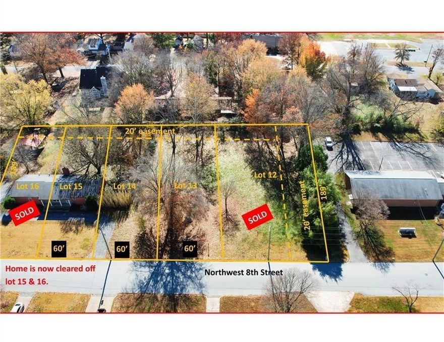 Rare opportunity to own a premium .26-acre lot in the heart of downtown Bentonville. Measuring 60 feet wide by 190 feet deep, this spacious property includes rear alley access and sits in a quiet, established residential neighborhood in the desirable Northwest quadrant—just under a mile from the Bentonville Square.
Enjoy walkable access to nearby schools and outdoor recreation. Jefferson Trail, located just across Bella Vista Road on NW 9th Street, connects directly to the scenic Park Springs Trails. You're also minutes from the paved Walton Trail, which leads to Slaughter Pen and Coler Mountain Bike Preserve—ideal for biking and hiking enthusiasts. Exciting developments are happening nearby: The upcoming mixed-use project This is a prime location for building your dream home or investment property. Zoning DN-2 allows for duplex. Lot also listed as multiple lot sale on MLS #1313817.