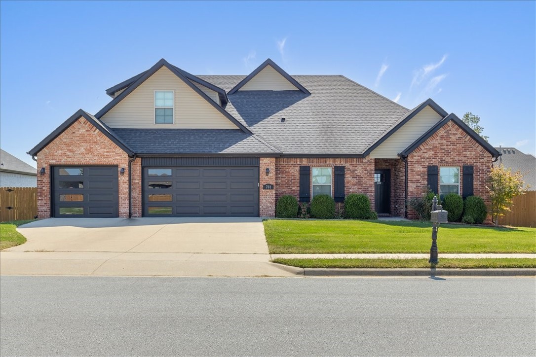 This lovingly maintained home in desirable Forest Park Subdivision is a must see! Level lot in a quiet, walkable neighborhood w/views of the greenspace. Easy access to nearby Bentonville West High & Gamble Elementary. Stately full brick exterior w/sharp black accents & NEW upgraded insulated garage doors. Spacious entry foyer w/coat & storage closets. Main level features wood, tile & carpet flooring, 9 ft & vaulted ceilings, living area w/gas FP, roomy primary suite w/soaking tub, walk-in shower, double vanity & walk-in closet in bath. 2 additional bedrooms & full bath near the front entry would be great for guests or home office. Rich espresso cabinets, granite counters & pantry in the roomy kitchen. Separate laundry w/extra closet storage or pet quarters. 2nd level 4th BR & full bath. Large bonus room up could be additional living space or 5th bedroom. 7x10 floored attic storage. Covered back patio, 12x20 deck & storage bldg in the pet ready fenced backyard. Super clean 3-car garage w/epoxy floors. Lots to love!