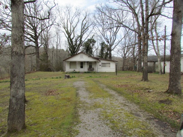Older home with several small outbuildings on 22 acres. Several acres of pasture and the rest is wooded with some marketable timber on it. 1 large pond is stocked with fish and there is another small pond on the property. The home is on a well, but there is a rural water meter on the property also. Beautiful views for your rural dream home or a small hobby farm close to town. House is sold āas isā with no repairs.