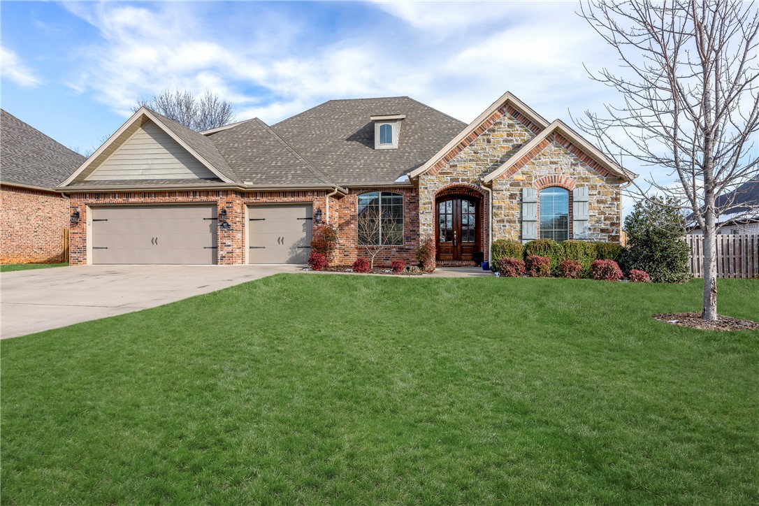 This beautiful masterpiece will welcome you with open arms, invitation beaming out from the stately double entry doors, through the modern living space and all the way to the massive picture windows overlooking the private, covered patio. Picture yourself relaxing here on a quiet summer evening, or enjoying the company of family and friends in this spacious, open home. This floor plan is as functional as it is stylish with lots of closets, storage and extra bedrooms! Built in the golden age of construction where you get fantastic modern styles but before material costs skyrocketed so builders could still afford quality details often missed in new homes today! A few of the quality features that stand out are the hardwood flooring, walk-in closets throughout, a bonus room above the 3 car garage, walk-in attic storage and a beautiful home office. All this situated in a quiet corner just moments from Lake Fayetteville, Don Tyson headquarters and I-49. Come see for yourself!