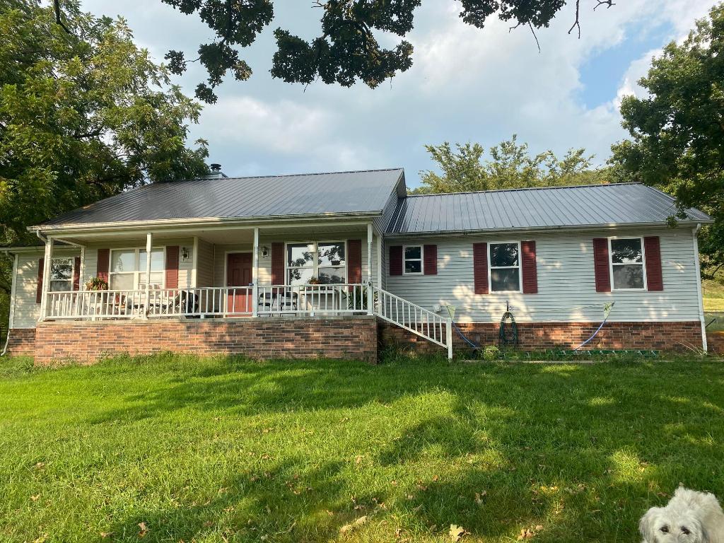 This Beautiful Carroll County property is just waiting for you to add the perfect touch! Spacious 4 bedroom, 2.5 bath, with two bonus rooms, laundry, and dining nook! This home is located close to town but boasts a gorgeous country setting in the Ozarks. Sitting on a little over 25 acres, approximately 20 acres being fenced and ready for a small farm. This property is being listed AS-IS. All in all this is a gorgeous, spacious home with a brand new roof. The property just needs a little TLC and maintenance. Perfect time to make it exactly as you would want it! This property could also be used as an investment opportunity and finish out the Maple Estates. It is parceled out in lots from 3.01-3.63 acres.