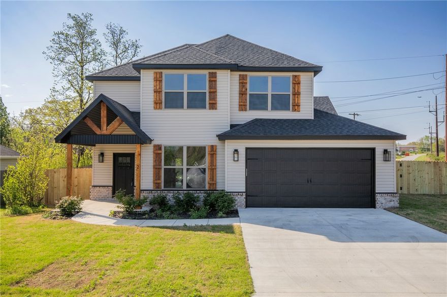 Brand-New Bella Vista Home on .3 FLAT Corner Lot! Discover this stunning new construction 2 bdrm+Office/Formal Dining Space+Bonus/Flex Room+2.5-ba home designed w/modern living in mind. Open-concept layout boasts spacious living room w/vaulted ceilings, abundant natural light, & cozy gas log fireplace. Kitchen shines featuring granite countertops, sleek cabinetry, SS appliances, & large island for entertaining. Enjoy split-bdrm plan for privacy, & beautiful engineered hardwood floors thru-out the main level. Luxurious primary suite is sure to please: Custom tile shower, separate free-standing tub, dual vanity, & WIC. Upstairs: 2nd Bdrm, full bath & bonus room/flex space. Covered patio overlooks flat privacy fenced yard—ideal for outdoor gatherings. Minutes from I-49, Wal-Mart HQ, schools, trails, & Bella Vista amenities (lakes, golf courses, clubhouses, community pools & gun range). Move-in ready home w/$5k towards rate buy down or closing costs thru builders preferred lender & RD financing ($0 down~100% financing)