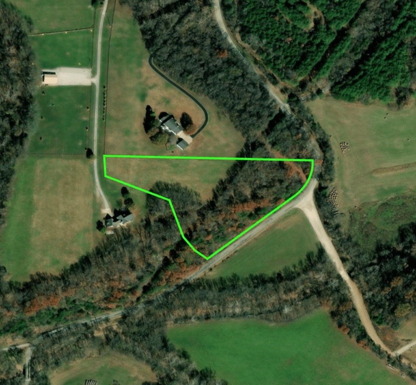 No covenants! If you're looking for a place for your estate, you've found it. Cleared lot with a beautiful backdrop, this oasis will allow you to build the home of your dreams and then some. Imagine being surrounded by lush foliage on a quiet road. This private acreage is your escape.