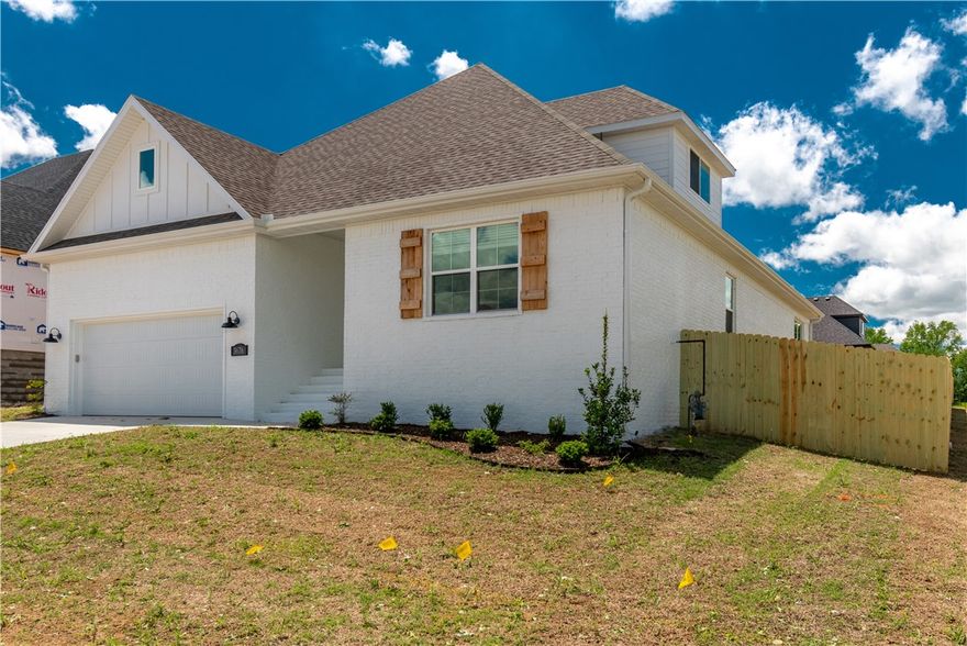 BRAND NEW ALL BRICK HOME IN HENDERSON PARK SUBDIVISION!! Walking distance to Lake Fayetteville, The Razorback Greenway Trail system, and the Botanical Gardens of the Ozarks! This Stunning home features 3 spacious bedrooms, a bonus room upstairs (could be 4th bedroom, office, or media/play room), 2 full baths, engineered hardwood floors in the living room, master bedroom, entry, and halls; beautiful quartz countertops, gas range, custom built cabinets to the ceiling, large kitchen island overlooking the living room, stainless steel appliances, partially covered back porch, a fully fenced backyard, and so much more!