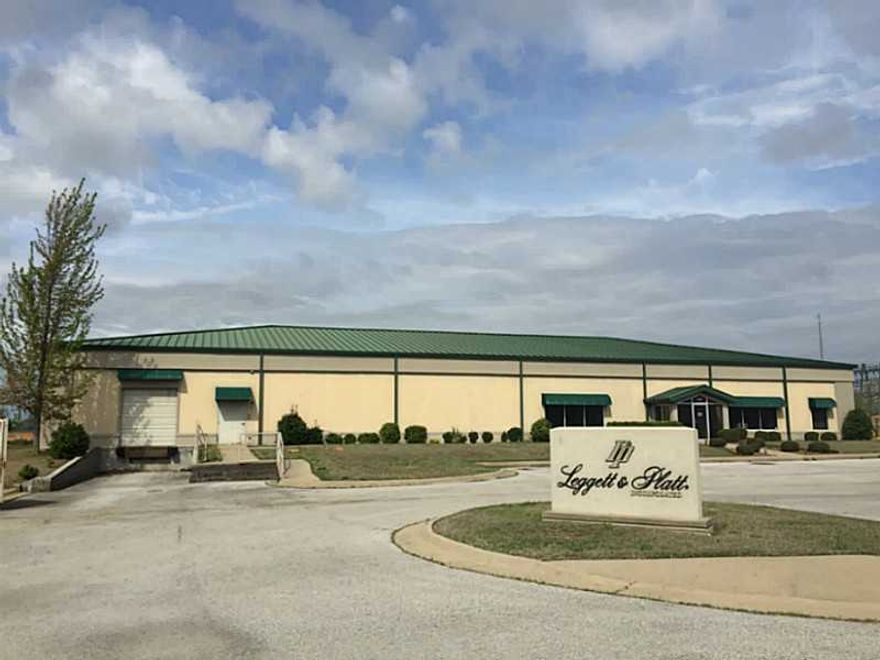 Located centrally between Walmart & Sam's home offices.   Has a dock high dock with 22 parking spaces