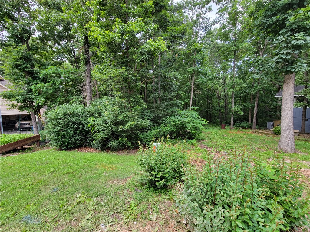 This large, cul-de-sac lot has access to SEWER and is located in the most desirable part of Bella Vista. It is also located on one of the many trails in the area as it backs up to the Rago trail and is within walking distance of the Metfield golf course/clubhouse. It has some slope to it, but not significant. Bentonville schools.