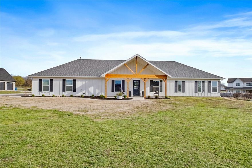 Fabulous, one-of-a-kind property in Bentonville, approx 4 miles from XNA! Gorgeous, newer, custom built modern farmhouse style home with guest house, sitting on amazing, level, 2-acre parcel! Front home boasts a huge, open living/chef kitchen area, large island with storage, expansive pantry with window, vaulted ceiling/beams, 2 beds, with option for 3rd bed in heated/cooled 3rd garage, formal dining, master ensuite with designer touches, including gorgeous crystal chandelier, freestanding tub, walk in shower, 2 sinks board and batten siding! Open/split floor plan! Designer touches throughout both, including exquisite quartz countertops, natural wood doors/beams, luxury tile, modern lighting, zoned, 3-way htg/air etc! Guest house boasts large master bedroom with ensuite, soaker tub, walk in rain shower, open living/kitchen, vaulted ceiling/beams, luxury vinyl plank, quartz countertops, marble look tile & office with window! No HOA/POA or restrictions! Tankless water heaters & barn doors. Bentonville Schools!